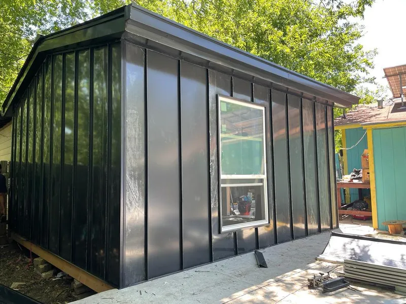 Black standing seam metal wall panels for Roof Inspection in Panama City