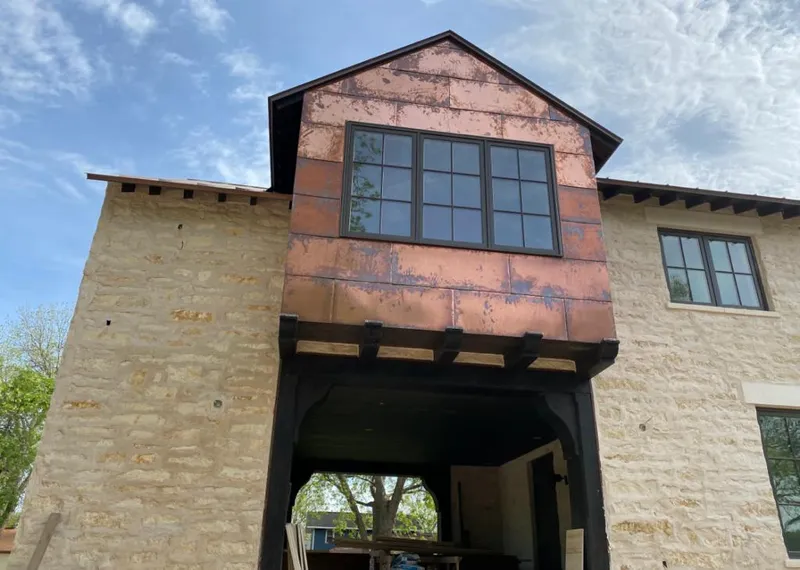 Copper metal panel facade on a stone building for Skylight Installation in Panama City